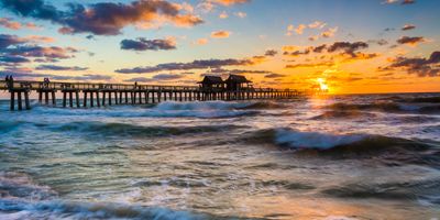 pier at the beach at sunset