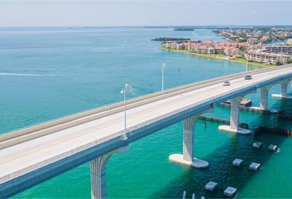 bridge over blue water leading into tierra verde