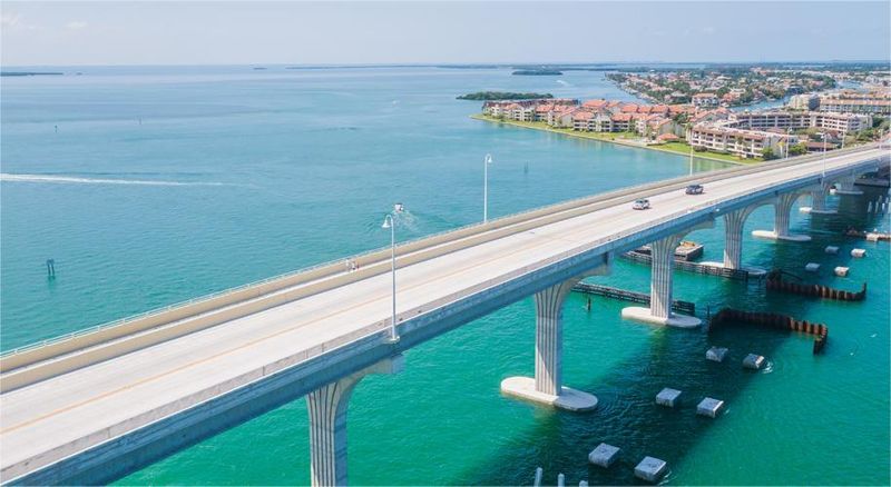 bridge over blue water leading into tierra verde