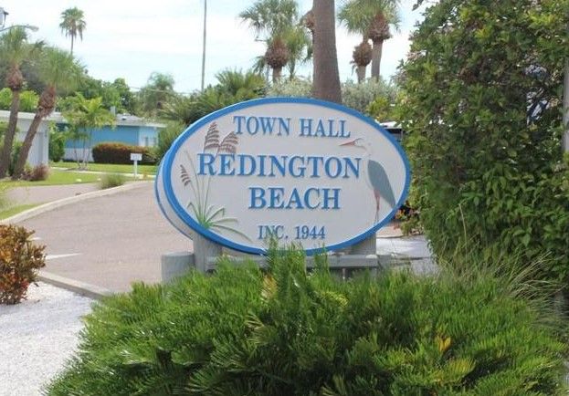 redington beach neighborhood sign in flower bed